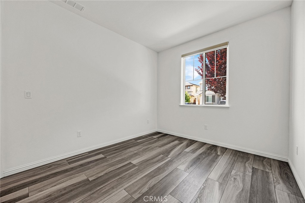 237 Goose Creek Avenue Brentwood, CA 94513 - Photo 36 of 49 a view of empty room with wooden floor