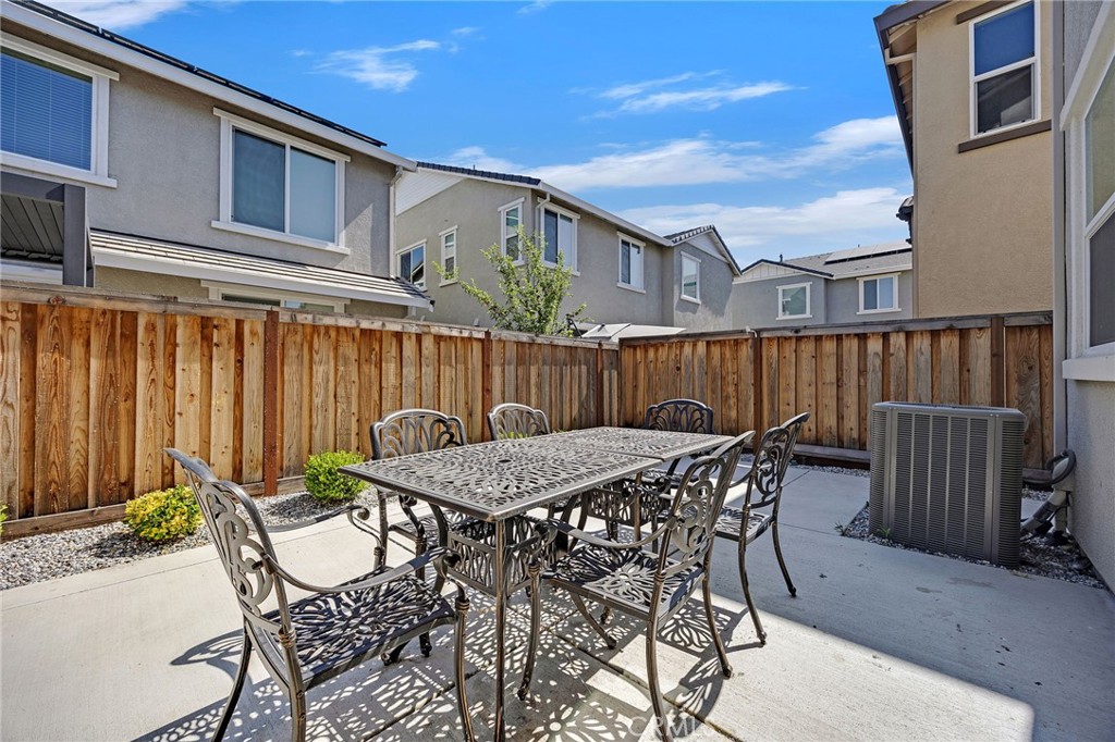 237 Goose Creek Avenue Brentwood, CA 94513 - Photo 38 of 49 a table and chairs with the outdoor seating