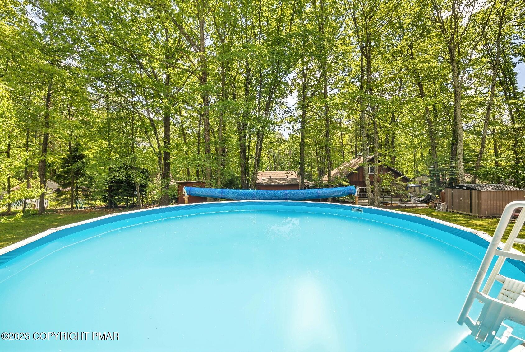 1106 Lakeside Drive Effort, PA 18330 - Photo 11 of 42 a view of a swimming pool with an outdoor space and seating area