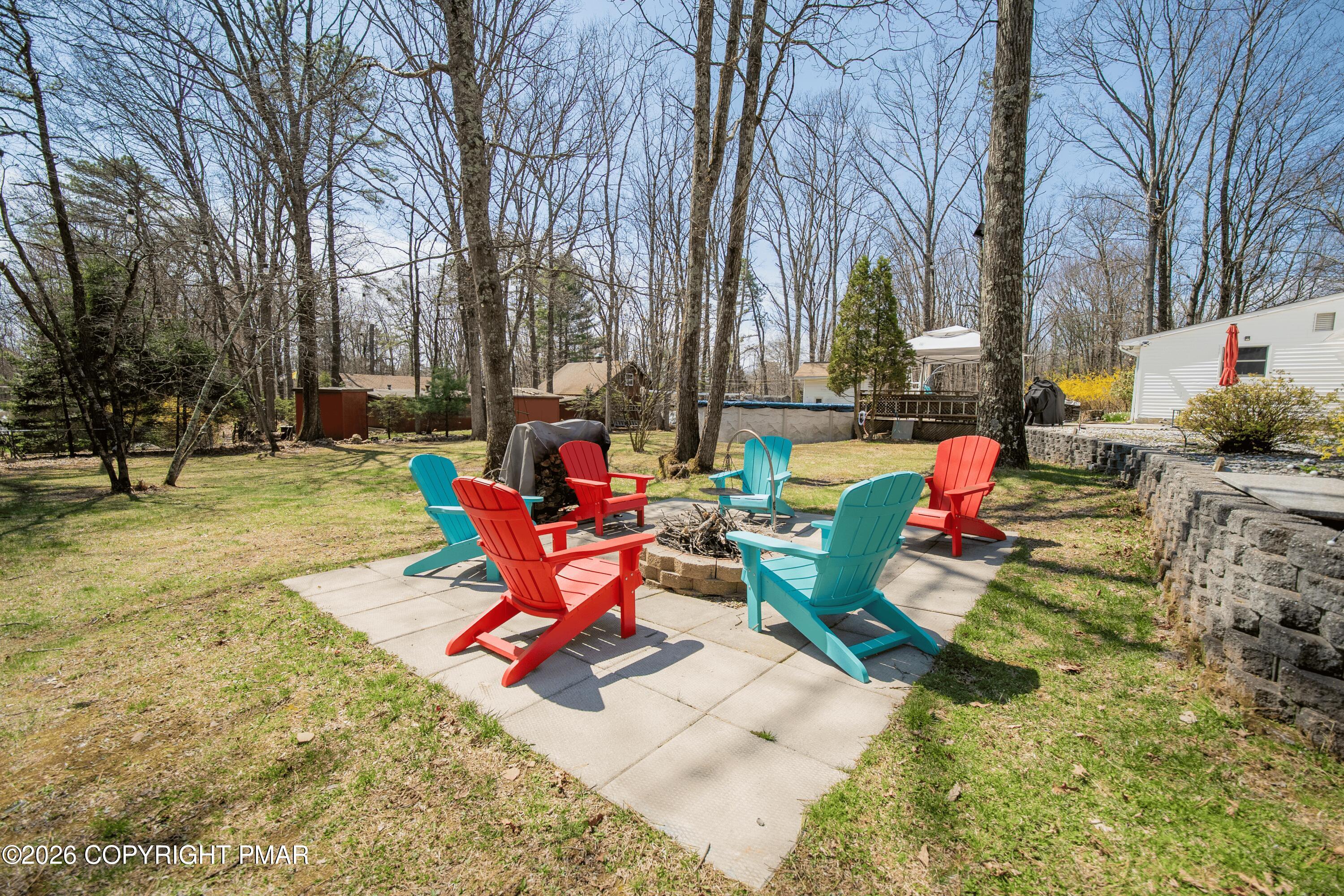 1106 Lakeside Drive Effort, PA 18330 - Photo 13 of 42 a backyard of a house with table and chairs