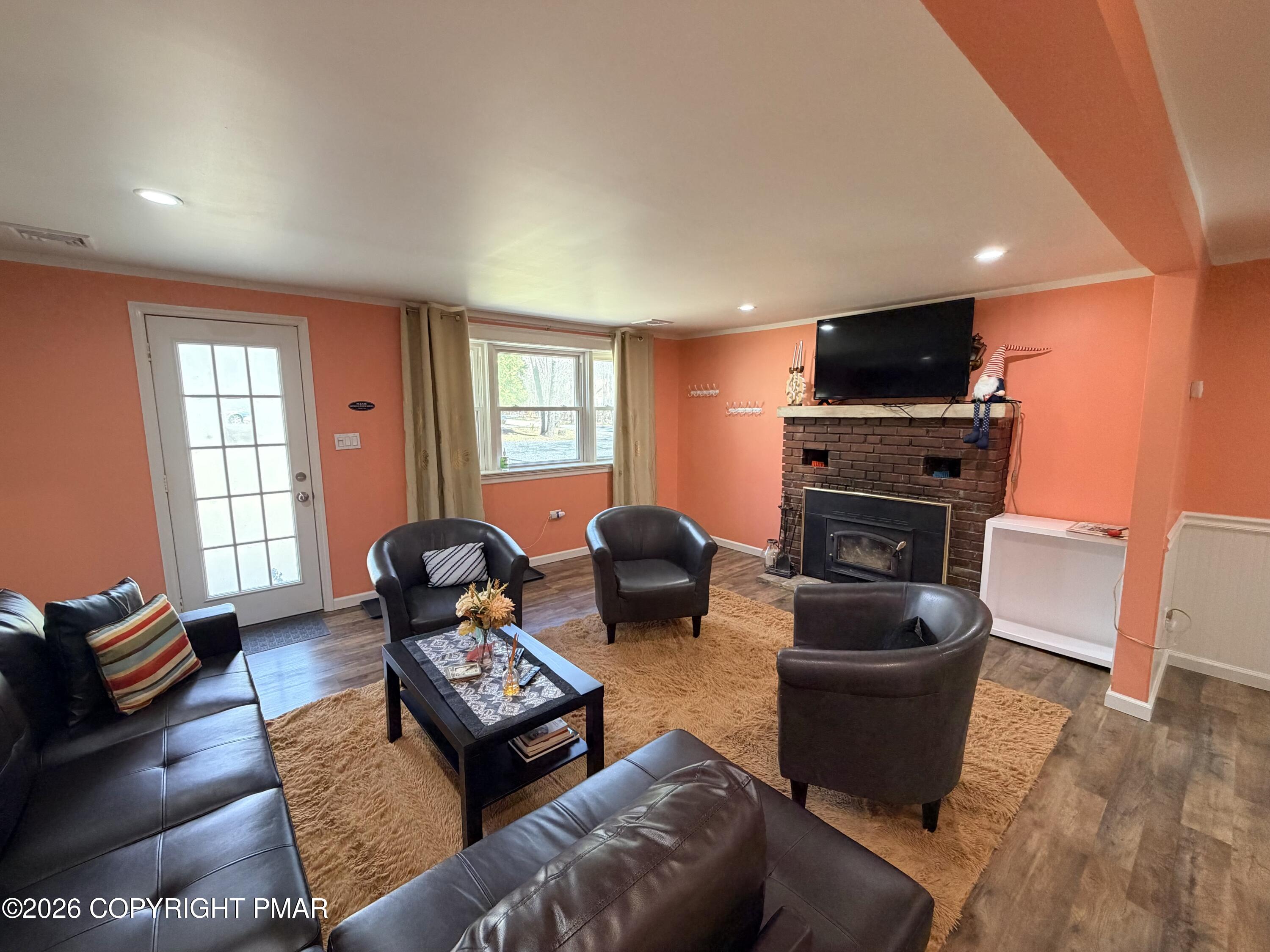 1106 Lakeside Drive Effort, PA 18330 - Photo 30 of 42 a living room with furniture a flat screen tv and a window