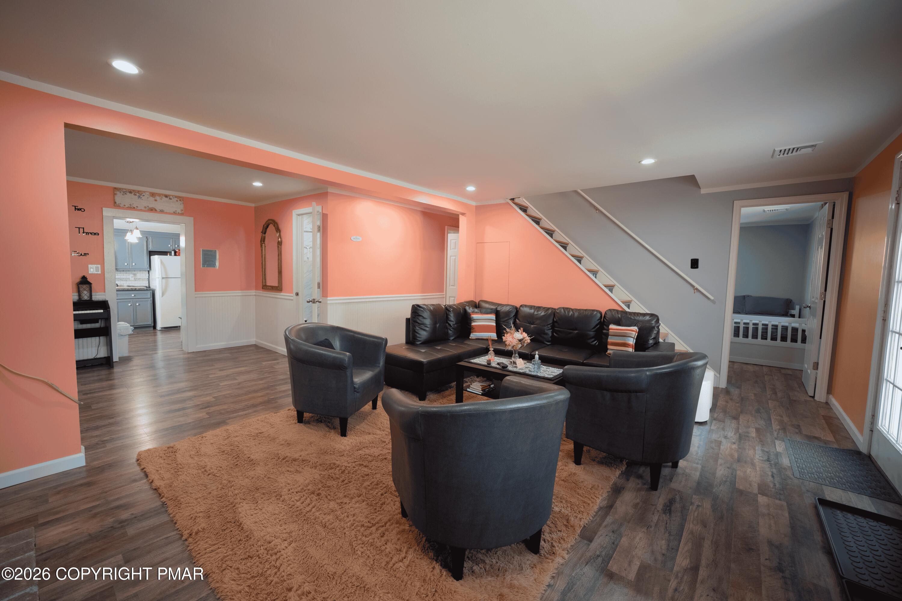 1106 Lakeside Drive Effort, PA 18330 - Photo 31 of 42 a living room with couches and kitchen view with wooden floor