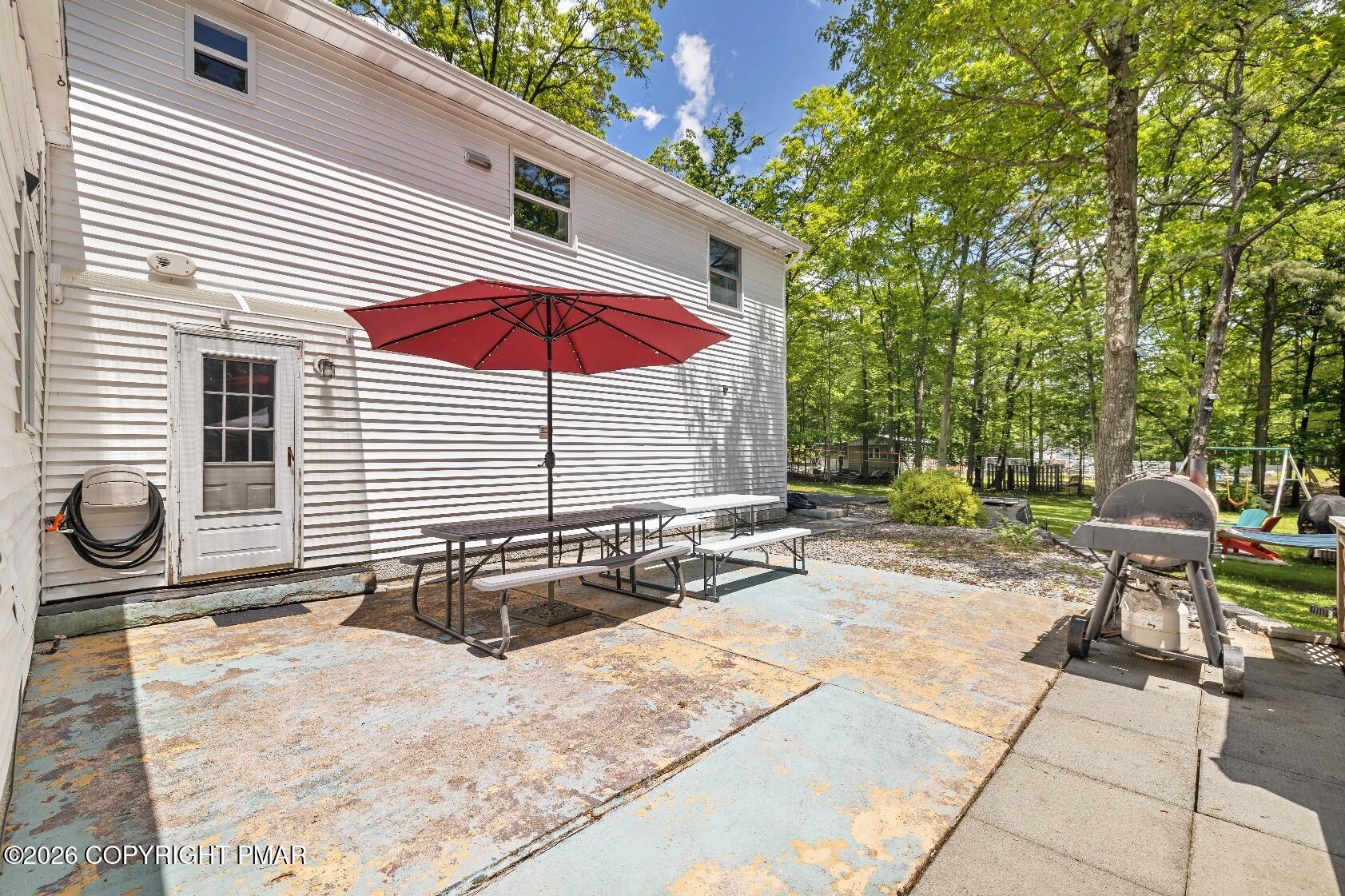 1106 Lakeside Drive Effort, PA 18330 - Photo 8 of 42 a backyard of a house with table and chairs
