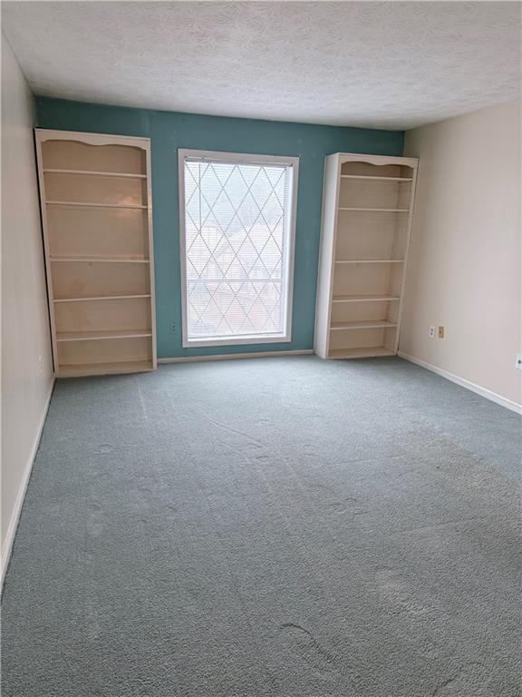 3237 Abbeywood Drive Decatur, GA 30034 - Photo 4 of 12 an empty room with closet and windows