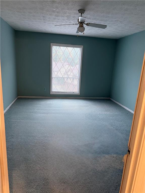 3237 Abbeywood Drive Decatur, GA 30034 - Photo 6 of 12 an empty room with windows