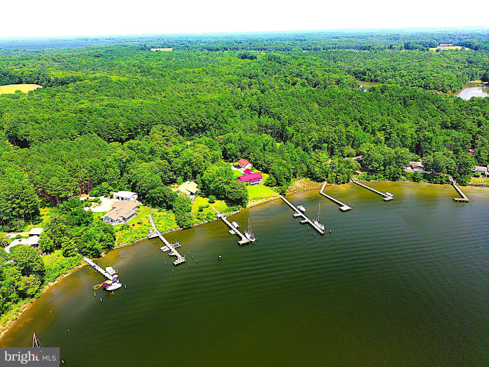 404 Woodbrook Road Lancaster, VA 22503 - Photo 3 of 60 a view of a lake with a house