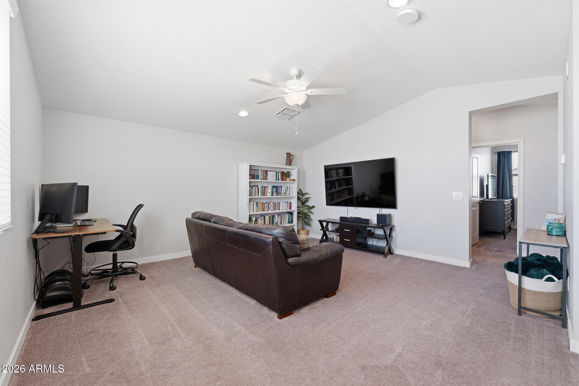 23069 East Mayberry Road Queen Creek, AZ 85142 - Photo 28 of 48 a living room with furniture and a flat screen tv