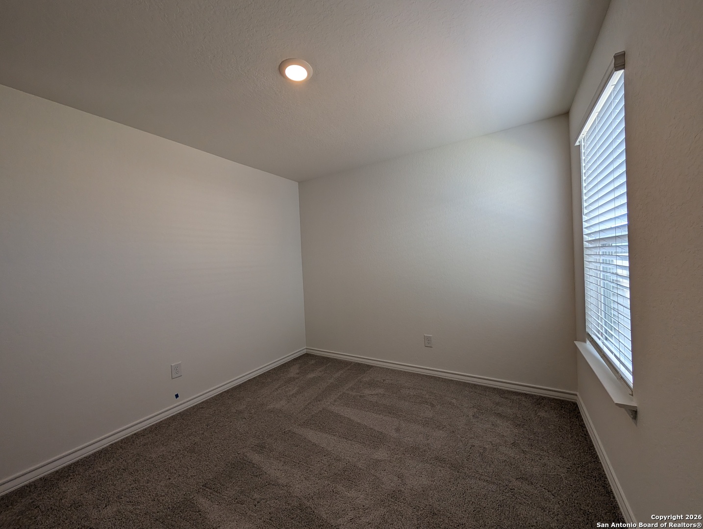 862 Bluegrass New Braunfels, TX 78130 - Photo 19 of 37 wooden floor and window in an empty room
