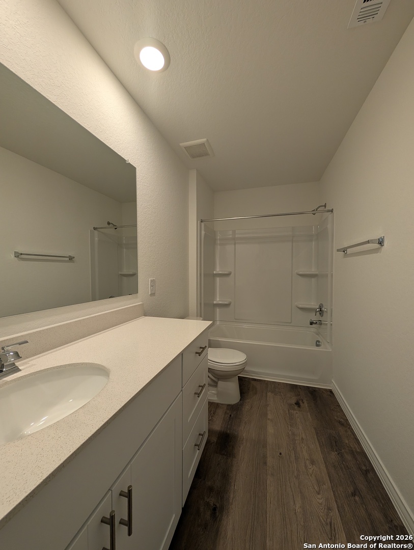 862 Bluegrass New Braunfels, TX 78130 - Photo 21 of 37 a bathroom with a sink a toilet and shower