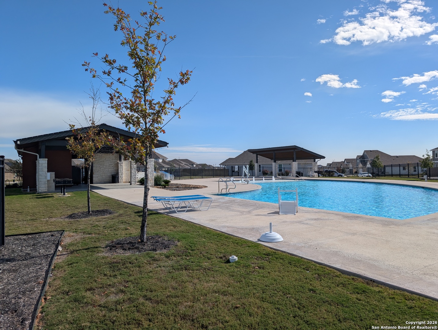 862 Bluegrass New Braunfels, TX 78130 - Photo 37 of 37 a swimming pool with lots of tress in the background