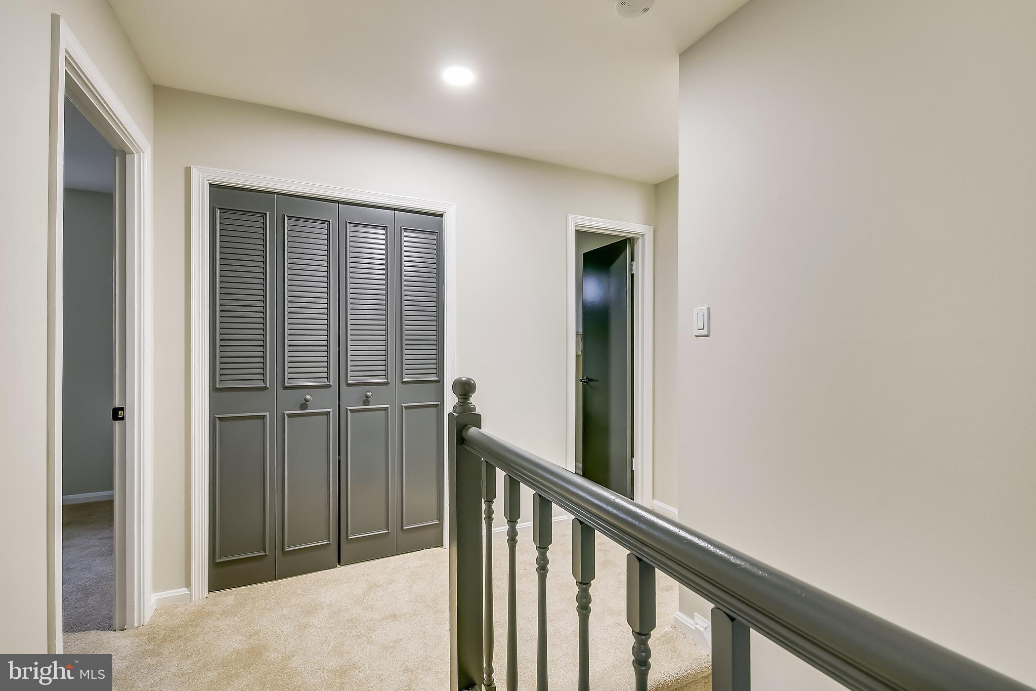 4238 Briars Road Olney, MD 20832 - Photo 20 of 44 a view of a hallway with wooden floor