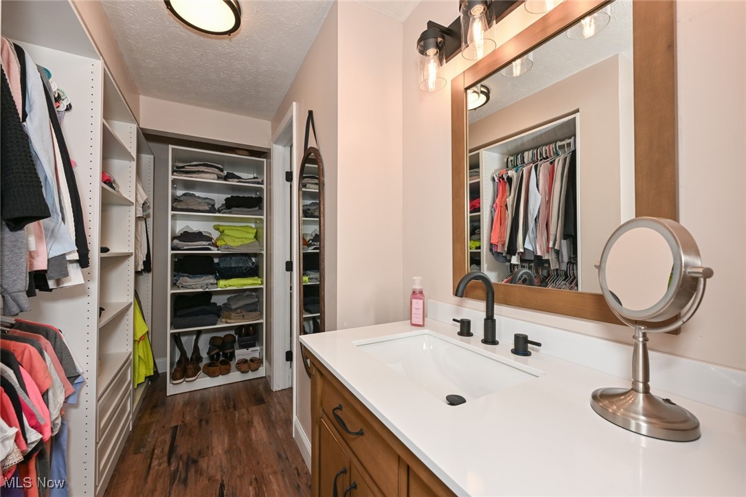 824 South Chillicothe Road, Unit 6 Aurora, OH 44202 - Photo 19 of 35 Custom built walk in closet off primary bedroom.