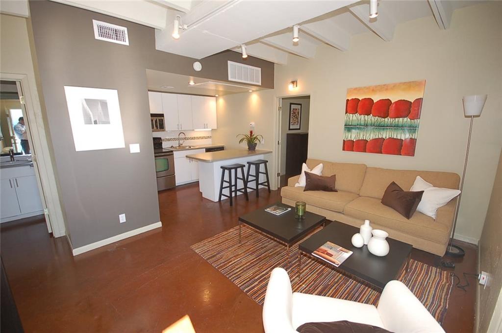 2408 Leon Street, Unit 109 Austin, TX 78705 - Photo 8 of 10 a living room with furniture and view of kitchen