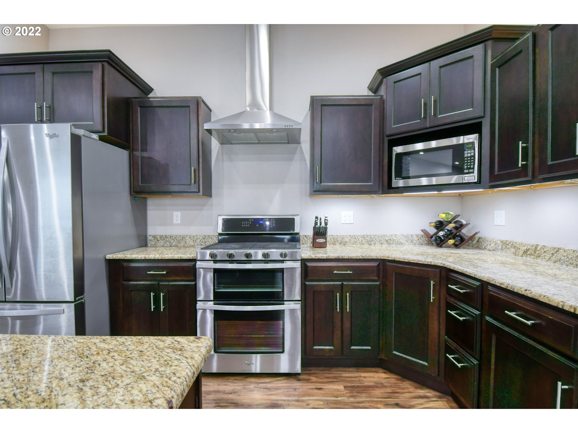 1803 Southwest 3rd Street Pendleton, OR 97801 - Photo 13 of 32 a kitchen with a sink stove and refrigerator