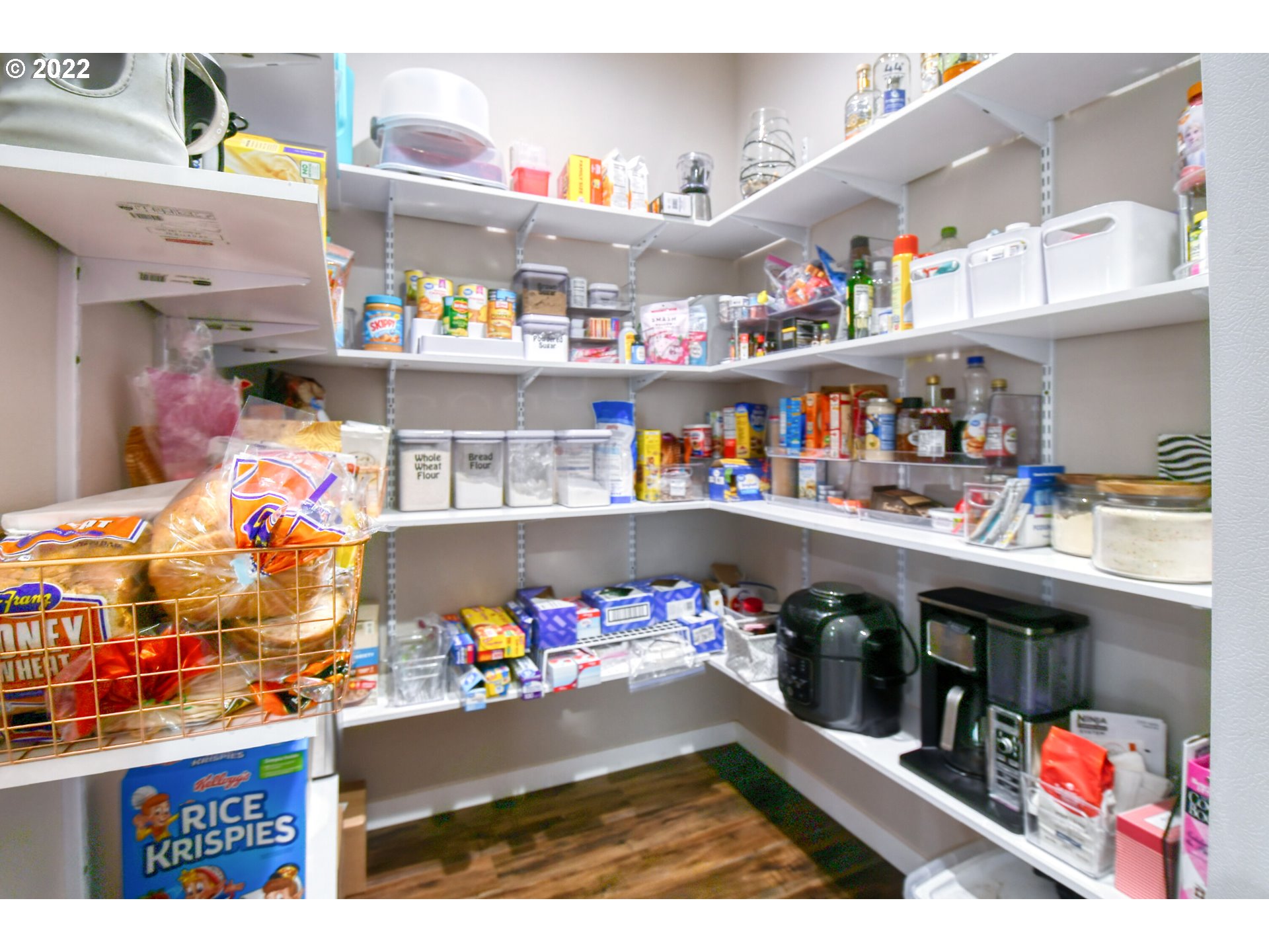 1803 Southwest 3rd Street Pendleton, OR 97801 - Photo 17 of 32 a store room with lots of clutter and refrigerator