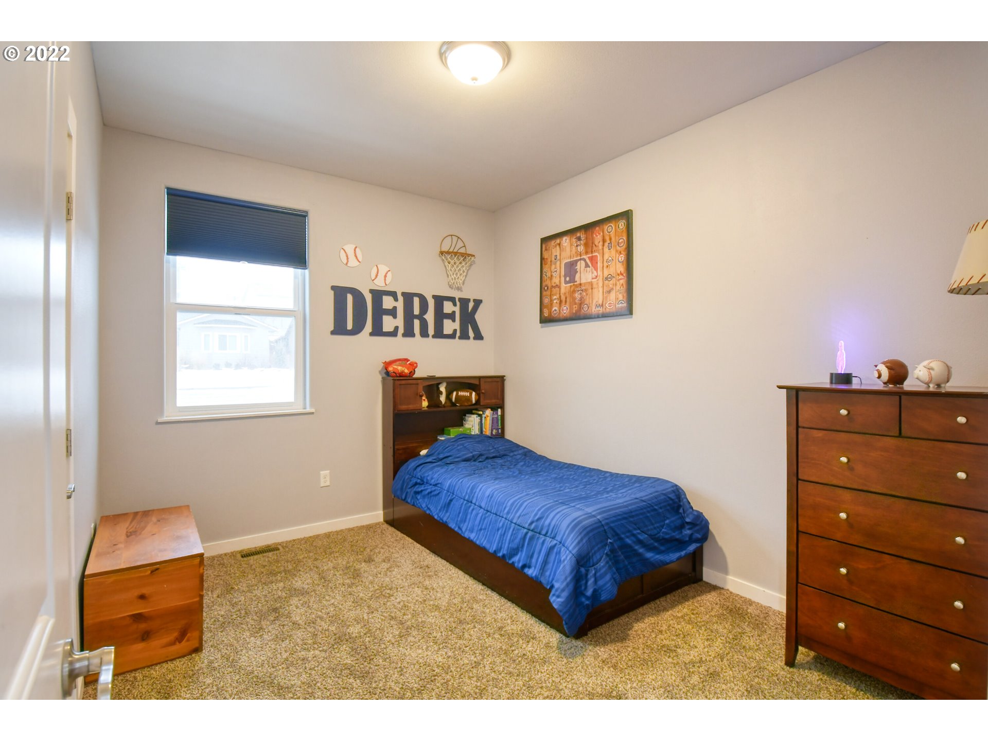 1803 Southwest 3rd Street Pendleton, OR 97801 - Photo 23 of 32 a bedroom with a bed and a window
