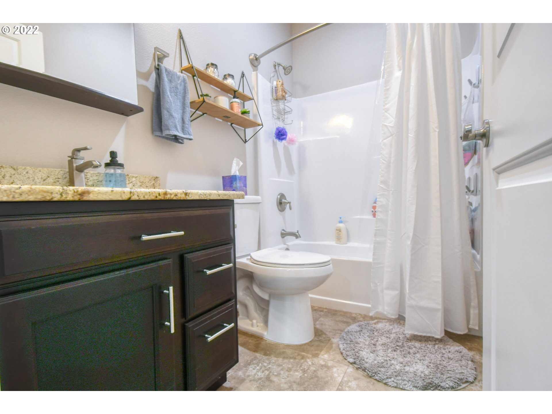 1803 Southwest 3rd Street Pendleton, OR 97801 - Photo 24 of 32 a bathroom with a sink and a mirror