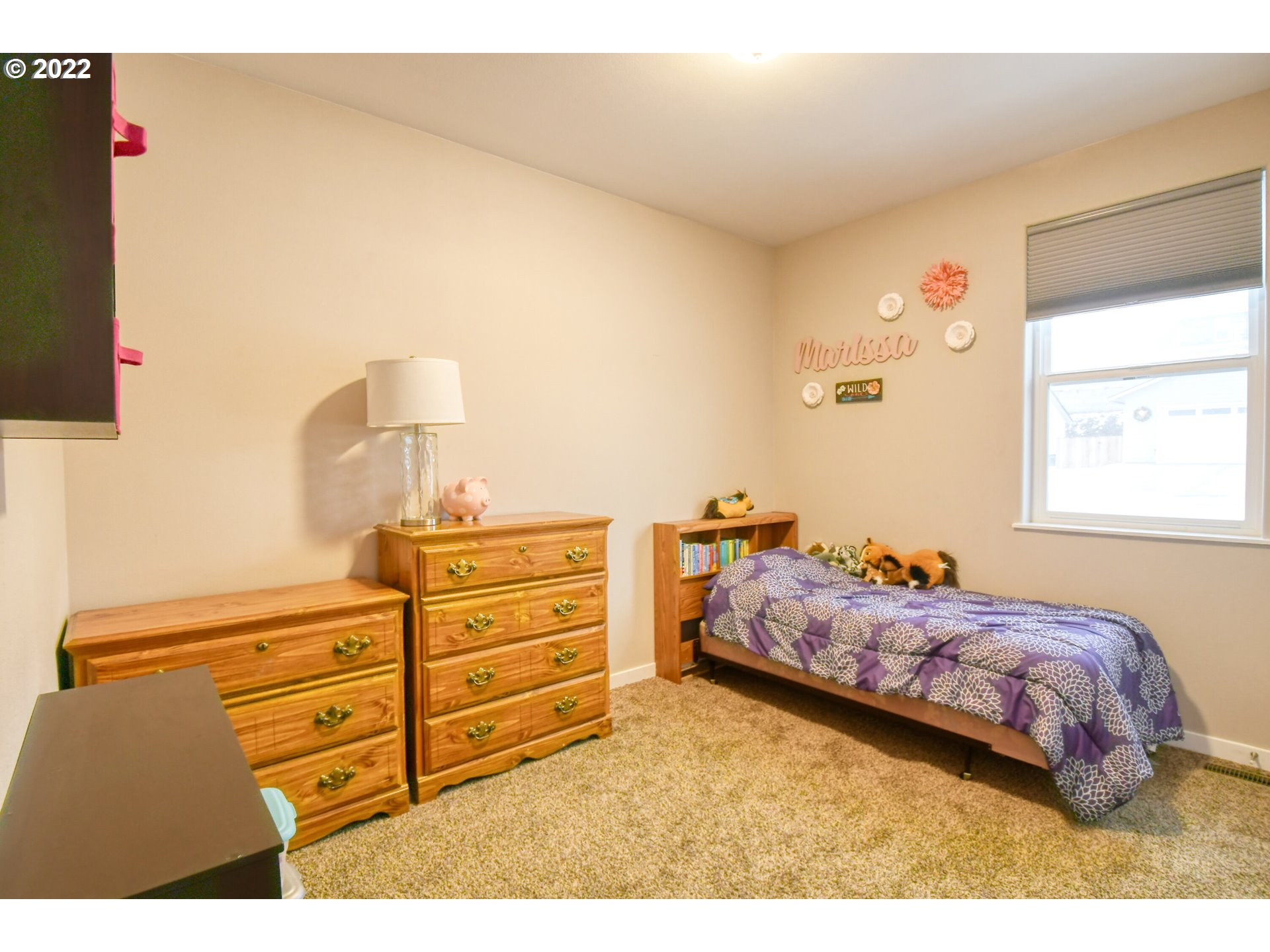 1803 Southwest 3rd Street Pendleton, OR 97801 - Photo 25 of 32 a bedroom with a bed and a night stand