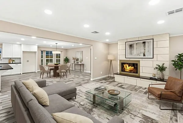 a living room with furniture and a fireplace