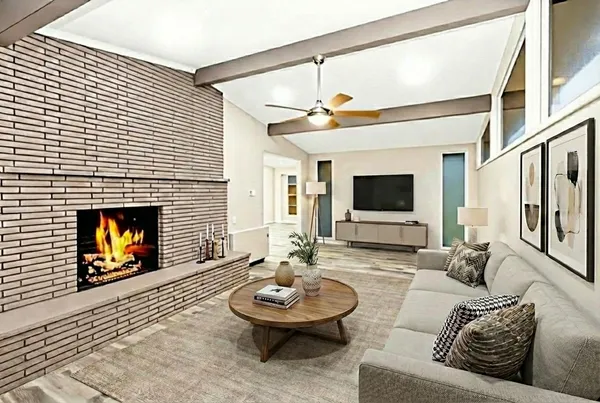 a living room with furniture and a fireplace