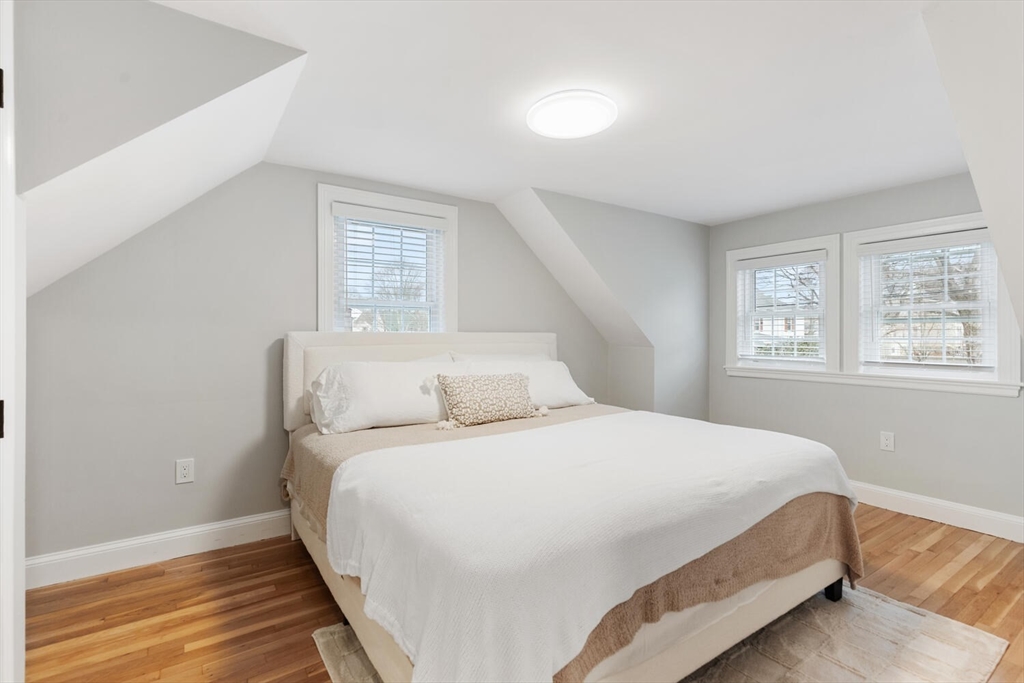 53 Perkins Street Stoneham, MA 02180 - Photo 23 of 34 a bedroom with a bed and a window