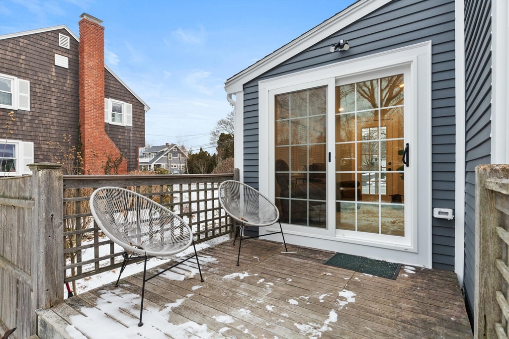 53 Perkins Street Stoneham, MA 02180 - Photo 29 of 34 a view of a porch with a bench