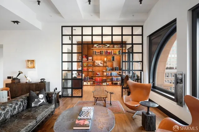 a kitchen with stainless steel appliances a sink and a refrigerator