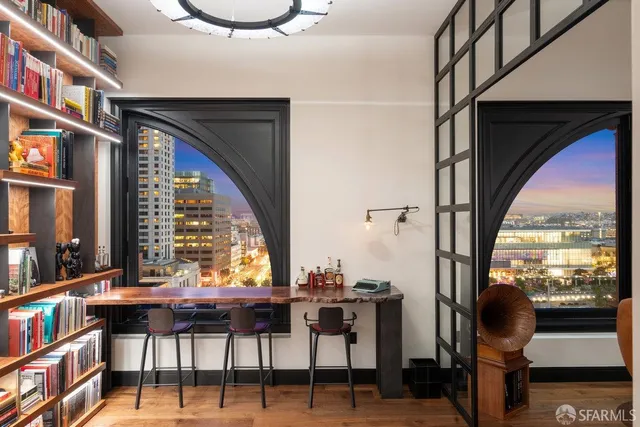 a bed sitting in a bedroom next to a window