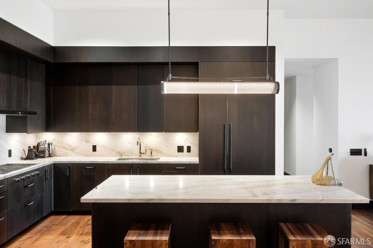 706 Mission Street, Unit 1001 San Francisco, CA 94103 - Photo 19 of 88 a kitchen with a sink and a refrigerator