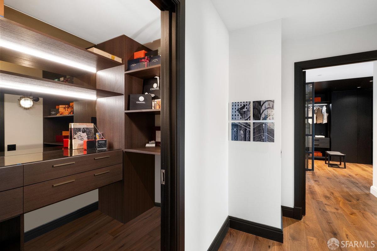 706 Mission Street, Unit 1001 San Francisco, CA 94103 - Photo 23 of 88 a view of a hallway to room with wooden floor and furniture