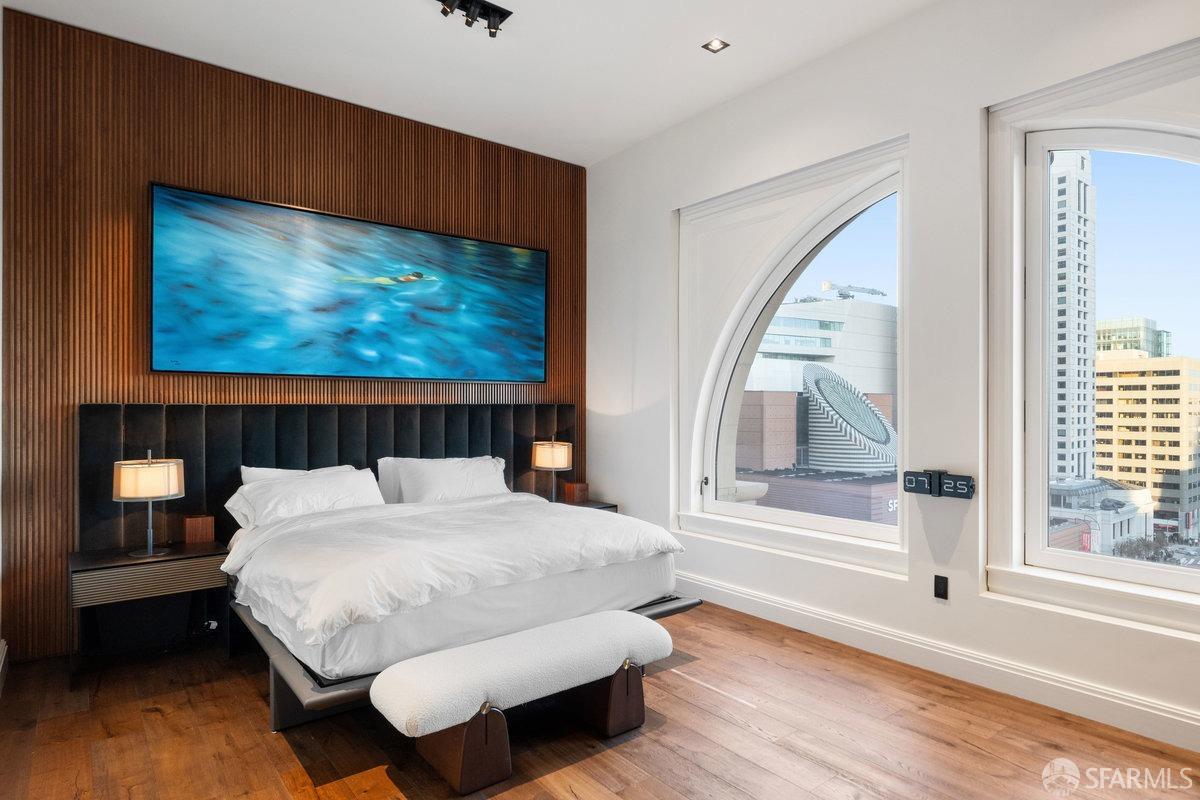 706 Mission Street, Unit 1001 San Francisco, CA 94103 - Photo 24 of 88 a bed sitting in a bedroom next to a window