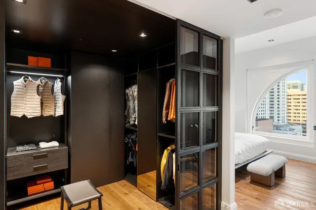 a bathroom with a glass door shower and a sink