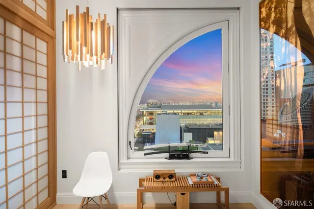 a view of a dining room with furniture and window