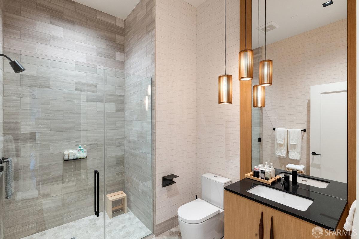706 Mission Street, Unit 1001 San Francisco, CA 94103 - Photo 35 of 88 a bathroom with a double vanity sink toilet and shower
