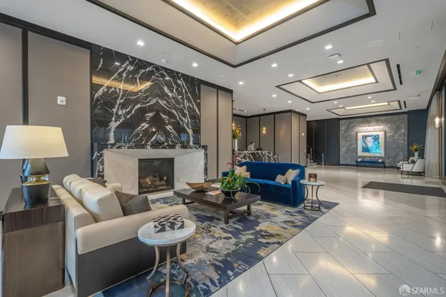 a view of a patio with a table and chairs and potted plants
