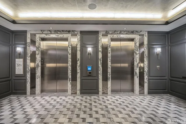 a view of a patio with table and chairs with a barbeque grill and a garden