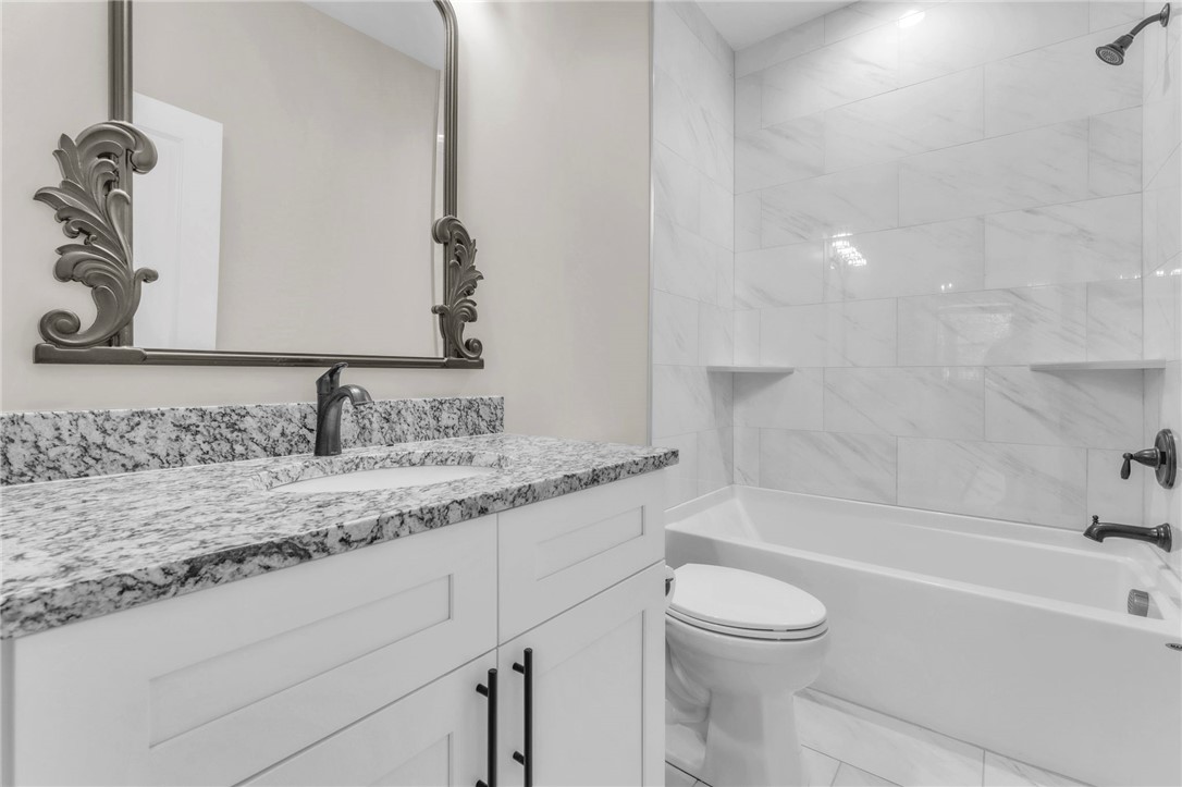 1015 Winmar Drive Anderson, SC 29621 - Photo 36 of 49 This bathroom offers a sleek vanity with ample counter space and a clean, inviting bath and shower area.