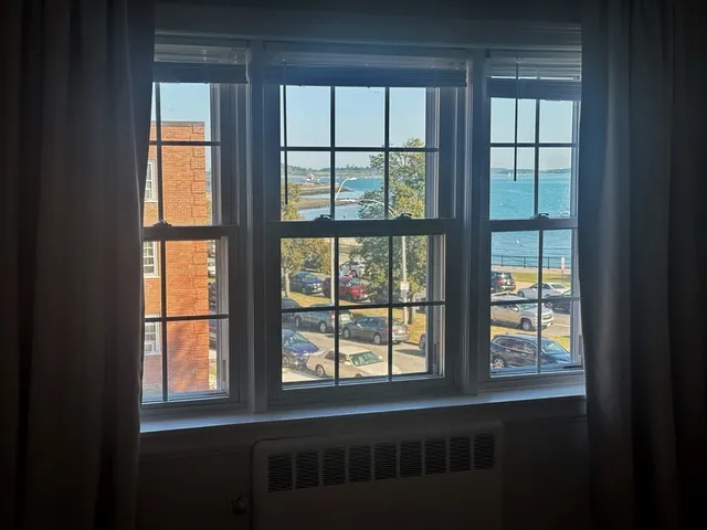 a view of an empty room with a window