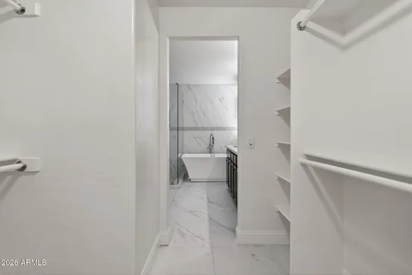 a bathroom with double vanity sinks and a mirror
