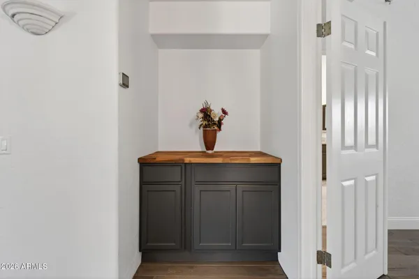 a view of wooden floor and windows in a room