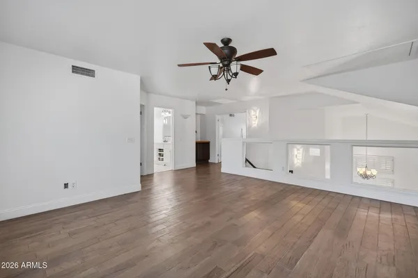 a bathroom with a sink double vanity granite tub and a mirror