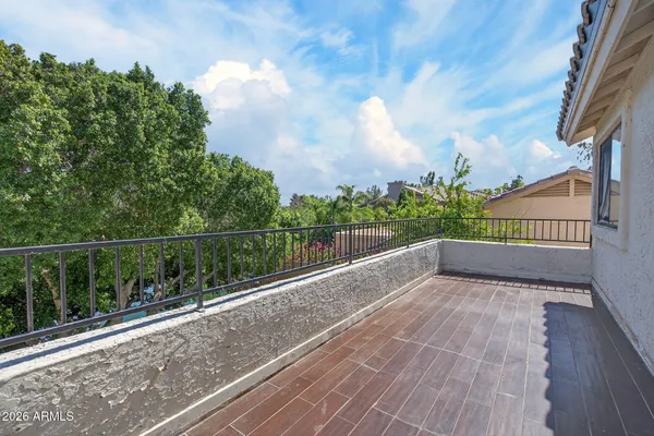 a view of balcony with wooden floor