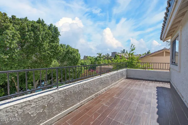 a view of balcony with wooden floor
