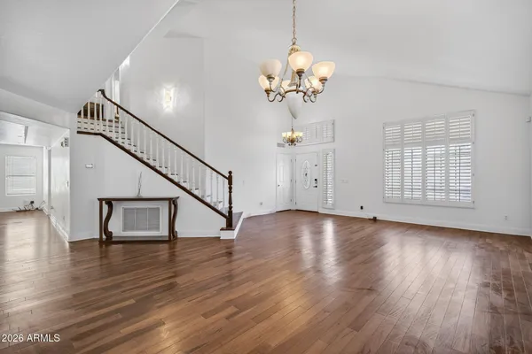 a view of a kitchen with wooden floor and a kitchen