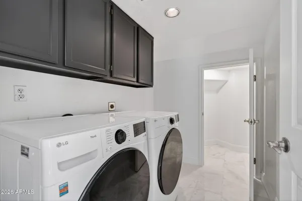 a view of a kitchen with washer and dryer