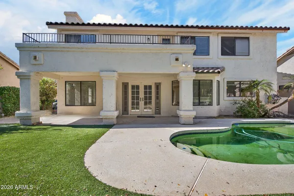 a front view of a house with swimming pool