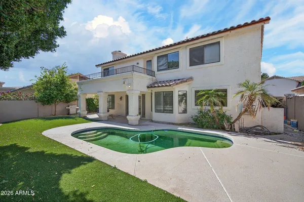 a view of yard with swimming pool and green space