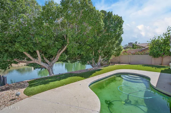 a view of a two chairs in a backyard