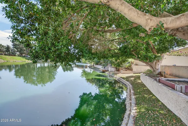 a wooden bench sitting in front of a building