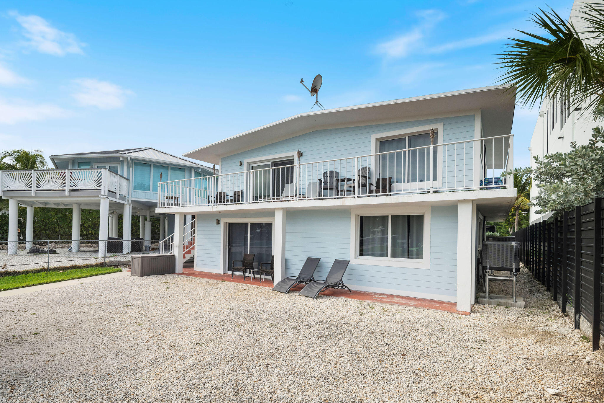 127 Seaside Avenue Key Largo, FL 33037 - Photo 11 of 50 a front view of a house with a yard